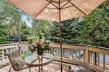 Enjoy the serene mountain views from this charming deck, perfect for outdoor dining or relaxation.