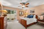 Experience comfort and style in this inviting bedroom, featuring a beautiful wooden bed frame and plush bedding.