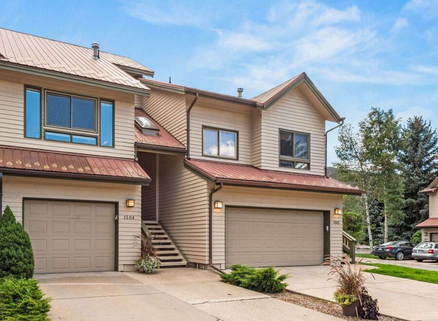 Discover this charming townhome featuring a durable metal roof and classic siding, perfect for mountain living.