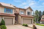 Discover this charming townhome featuring a durable metal roof and classic siding, perfect for mountain living.