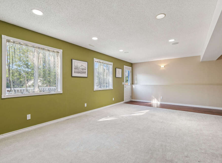 Discover this spacious basement living area, perfect for relaxation and entertainment.