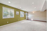 Discover this spacious basement living area, perfect for relaxation and entertainment.