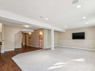 Discover this spacious finished basement, perfect for entertainment and relaxation.