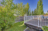 Enjoy outdoor living with this spacious wooden deck, perfect for entertaining or relaxing.