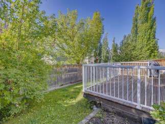 Enjoy outdoor living with this spacious wooden deck, perfect for entertaining or relaxing.