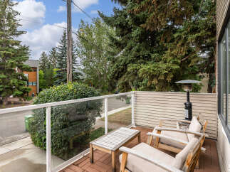 Enjoy outdoor living on this charming balcony, perfect for relaxing or entertaining.