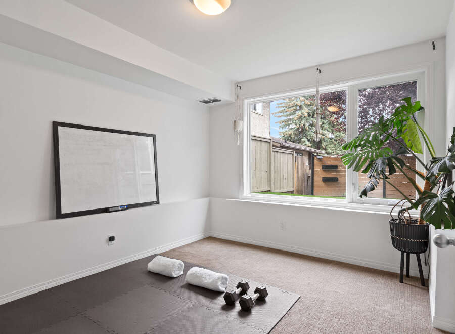 Transform this versatile room into your personal home gym or a productive office space.