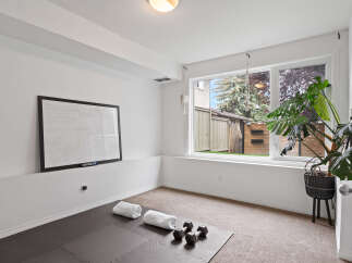Transform this versatile room into your personal home gym or a productive office space.