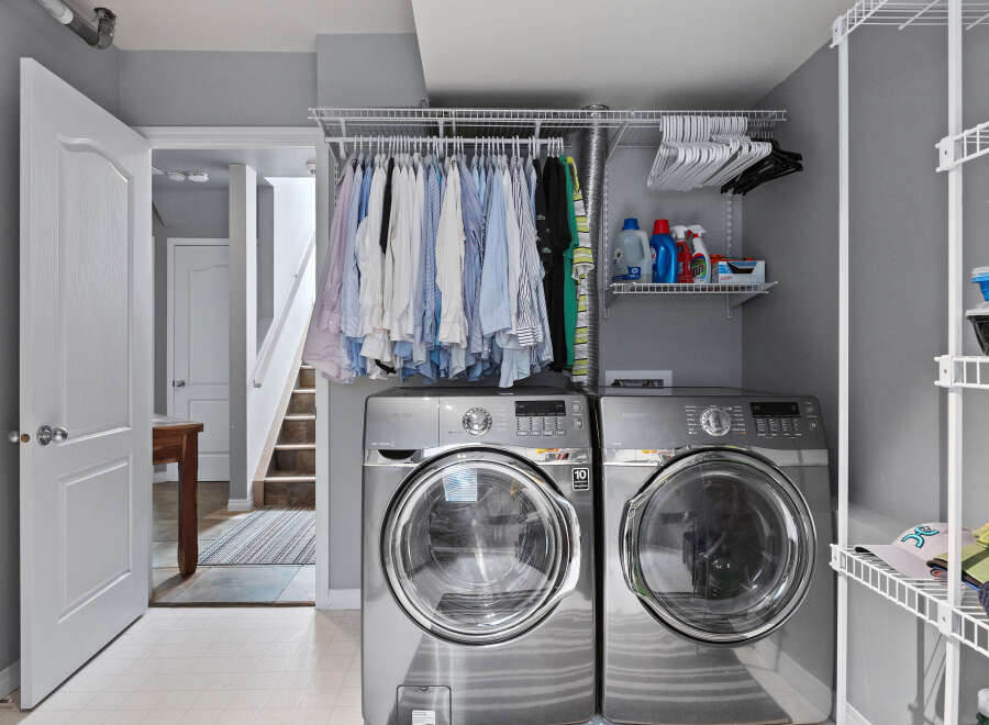 This laundry room features a stacked Samsung washer and dryer set, perfect for maximizing space.