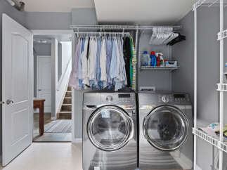 This laundry room features a stacked Samsung washer and dryer set, perfect for maximizing space.