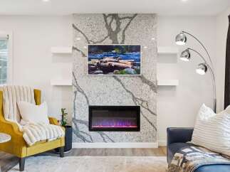 Experience modern living with this stunning fireplace featuring a unique granite surround and a vibrant electric fire.