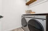 This modern laundry room features a sleek Samsung washer and dryer set, perfect for handling large loads.