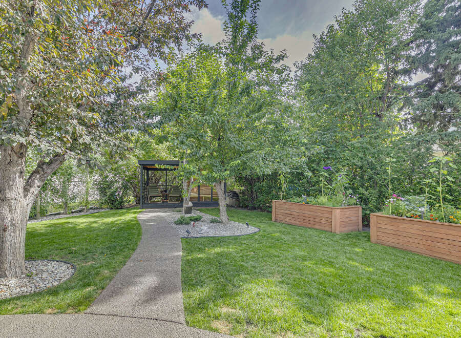 Discover your private oasis with this beautifully landscaped backyard, featuring a modern gazebo perfect for relaxation and entertaining.