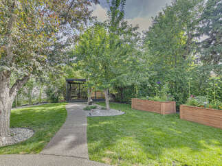 Discover your private oasis with this beautifully landscaped backyard, featuring a modern gazebo perfect for relaxation and entertaining.