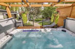 Indulge in ultimate relaxation with this luxurious hot tub, perfect for unwinding after a long day.