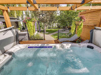 Indulge in ultimate relaxation with this luxurious hot tub, perfect for unwinding after a long day.