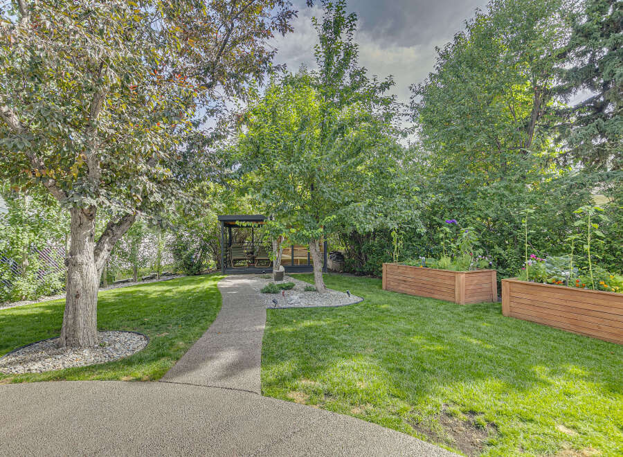 Discover this beautifully landscaped backyard oasis, perfect for relaxation and entertaining.