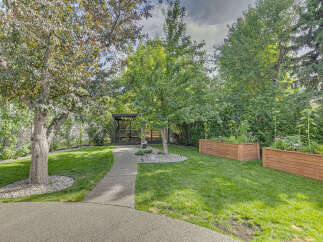Discover this beautifully landscaped backyard oasis, perfect for relaxation and entertaining.