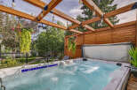 Experience ultimate relaxation in this backyard oasis, featuring a luxurious hot tub perfect for unwinding.