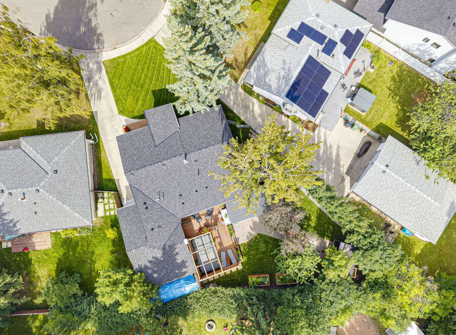 Discover this stunning aerial view showcasing a beautifully maintained property with a spacious backyard, perfect for outdoor living.