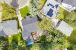 Discover this stunning aerial view showcasing a beautifully maintained property with a spacious backyard, perfect for outdoor living.