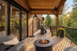 Experience outdoor living at its finest on this expansive wooden deck, complete with a cozy fire pit and comfortable seating.