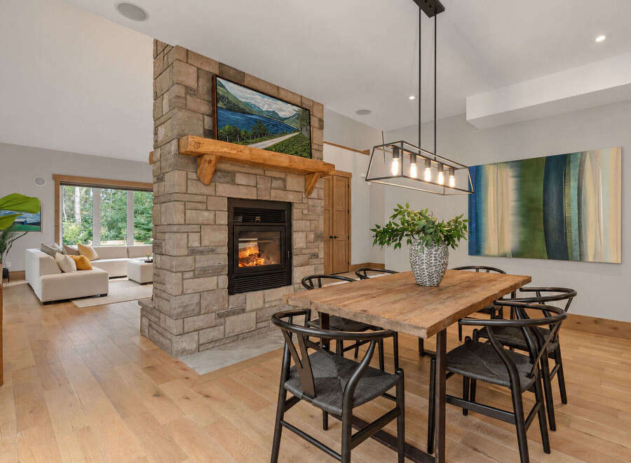 Experience the perfect blend of rustic charm and modern elegance in this stunning open-concept living and dining area.