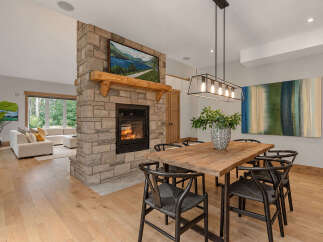 Experience the perfect blend of rustic charm and modern elegance in this stunning open-concept living and dining area.