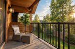Enjoy your morning coffee or evening relaxation on this charming balcony, complete with comfortable seating and a decorative plant.