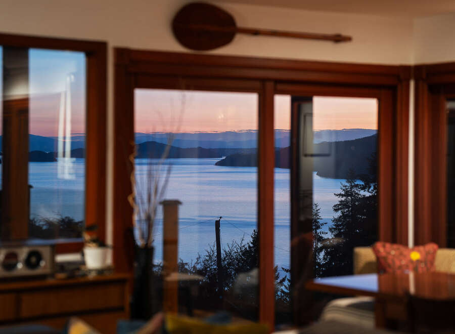 Experience breathtaking sunset views over the water from this stunning property.