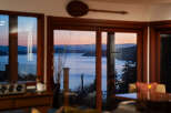 Experience breathtaking sunset views over the water from this stunning property.