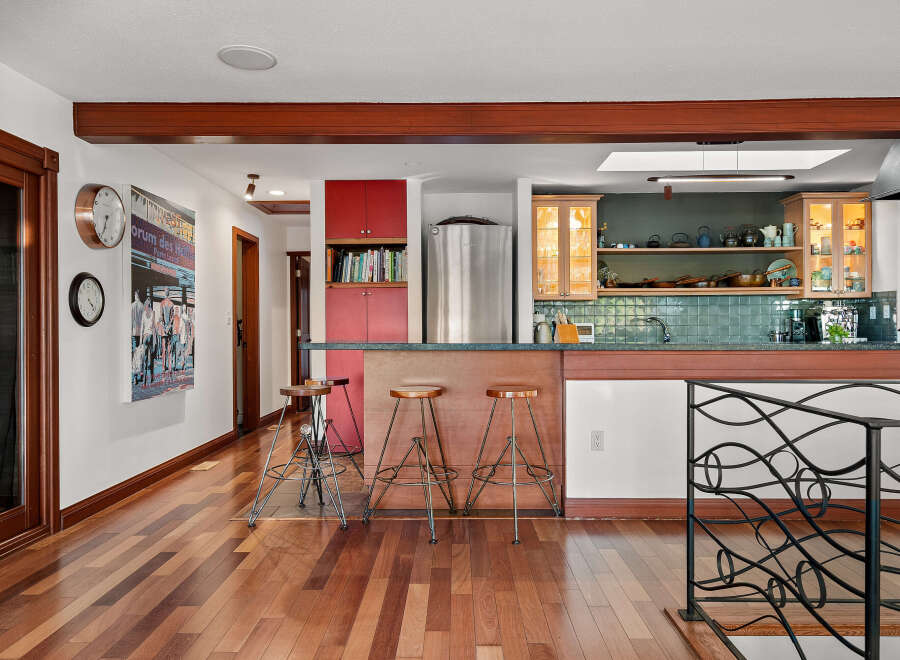 This spacious kitchen features a large island with bar seating, perfect for casual dining and entertaining.
