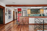 This spacious kitchen features a large island with bar seating, perfect for casual dining and entertaining.