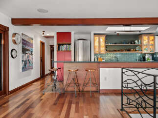 This spacious kitchen features a large island with bar seating, perfect for casual dining and entertaining.