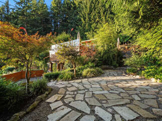 Discover a unique architectural gem nestled amidst lush greenery and vibrant foliage.