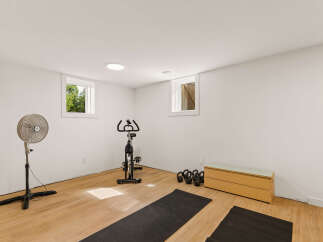 This home features a dedicated home gym space, perfect for your fitness routine.