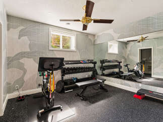Transform your home into a personal fitness sanctuary with this well-equipped gym.