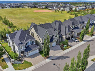 Experience luxury living in this stunning modern home, featuring elegant architecture and a prime location overlooking a vibrant sports field.