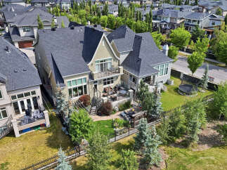Experience luxury living in this stunning multi-story home featuring a spacious backyard with a patio, perfect for entertaining.