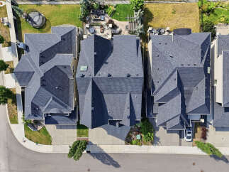Experience modern living in this stunning aerial view of a row of contemporary townhouses.
