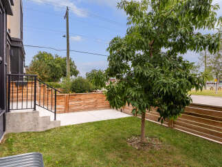 Step into this modern home featuring a private outdoor space perfect for relaxation and entertaining.
