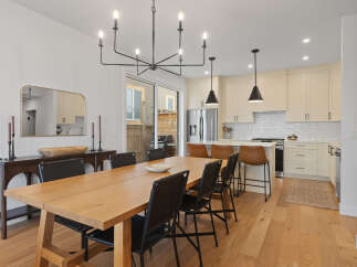 Experience modern living in this stunning open-concept dining and kitchen area.