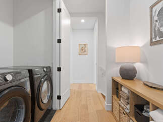 Discover a modern and functional laundry room featuring a sleek Samsung washer and dryer set.