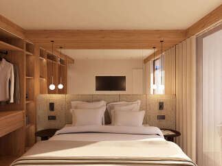 Experience modern luxury in this beautifully appointed bedroom featuring a spacious king-sized bed with plush bedding and a stylish upholstered headboard.