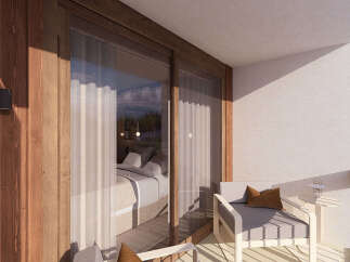Experience luxurious mountain living with this stunning balcony view, featuring a cozy seating area perfect for enjoying the crisp alpine air.