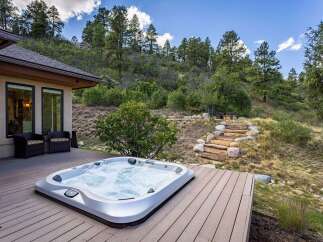 Experience ultimate relaxation in this stunning backyard oasis, featuring a luxurious hot tub perfect for unwinding.