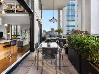 Experience luxurious urban living with this stunning penthouse featuring a spacious balcony perfect for entertaining.