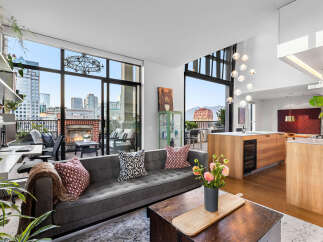 Experience urban living at its finest in this stunning condo with breathtaking city and mountain views.
