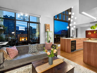 Experience luxury city living with this stunning apartment featuring a modern open-concept living space and a breathtaking balcony view.