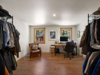 This versatile room offers a dedicated workspace with a computer and desk, perfect for remote work or study.